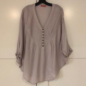 Bliss with cape style sleeves and button detail